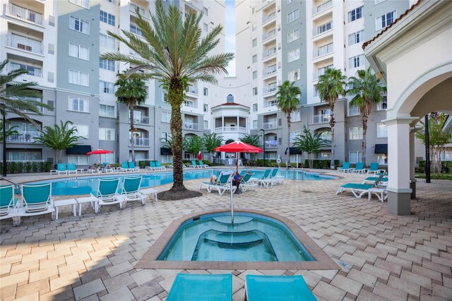 view of pool featuring a hot tub