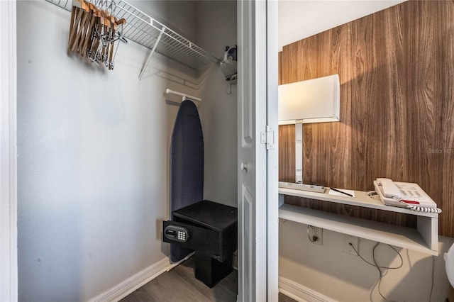 mudroom featuring wood walls and hardwood / wood-style flooring