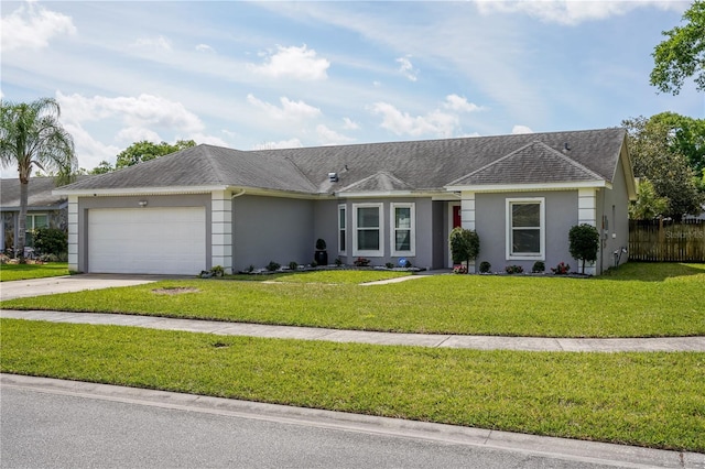 ranch-style home with a front yard and a garage