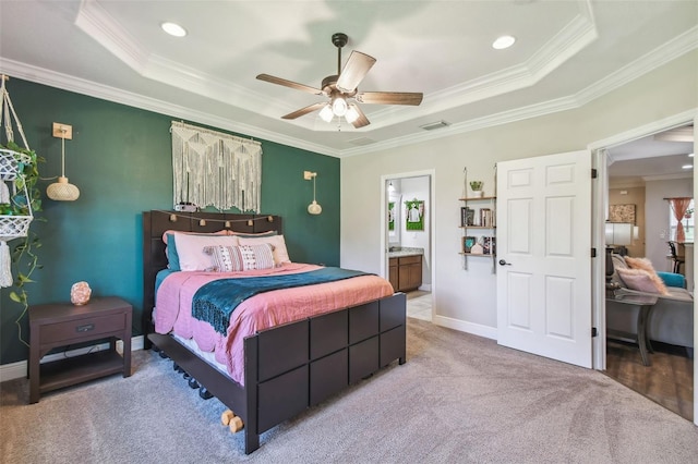 bedroom featuring ensuite bath, ceiling fan, and crown molding