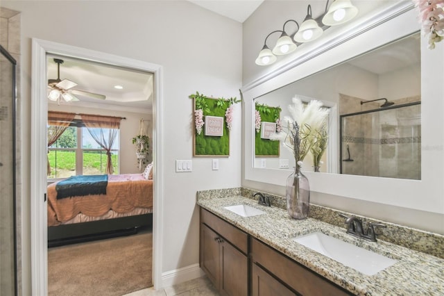 bathroom featuring walk in shower, tile patterned floors, ornamental molding, ceiling fan, and vanity