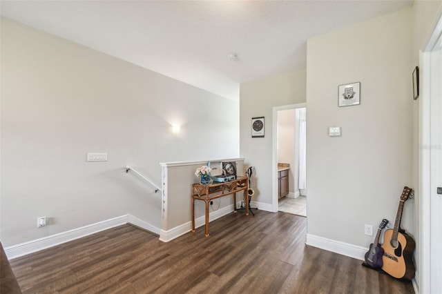 hallway with dark wood-type flooring