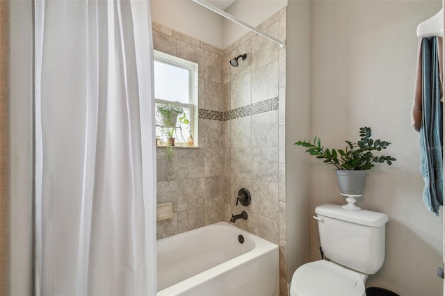 bathroom with shower / bath combo with shower curtain and toilet