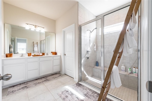 bathroom featuring vanity, tile patterned flooring, and an enclosed shower