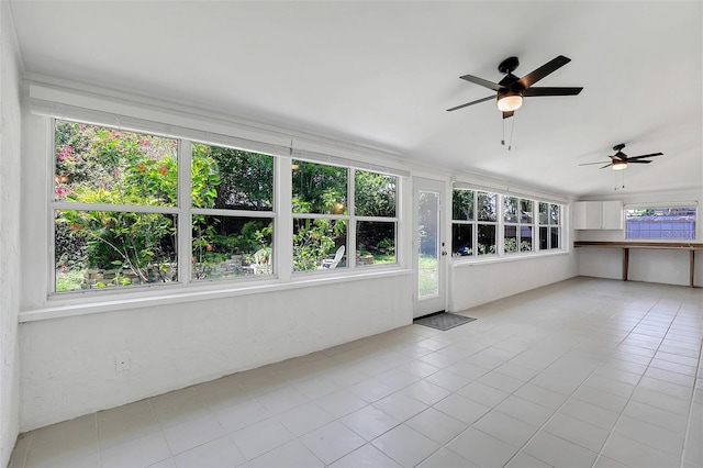 unfurnished sunroom with plenty of natural light and ceiling fan