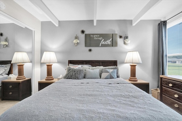 tiled bedroom with beamed ceiling