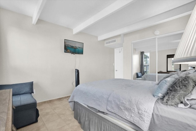 bedroom with beam ceiling