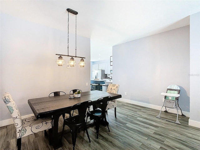 dining area with wood-type flooring