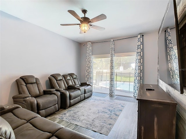 living room with ceiling fan and light hardwood / wood-style floors