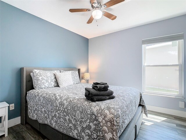 bedroom featuring wood-type flooring and ceiling fan