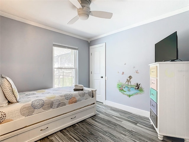 bedroom featuring ornamental molding, ceiling fan, and hardwood / wood-style floors