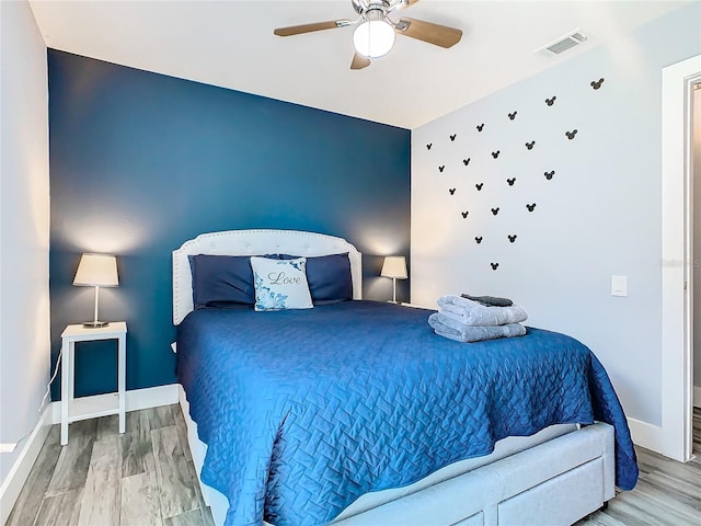 bedroom featuring wood-type flooring and ceiling fan