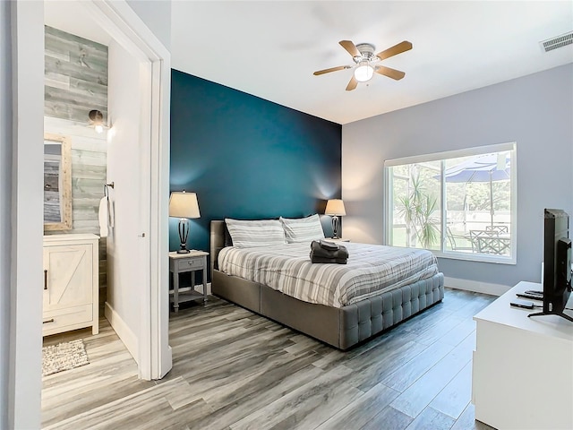 bedroom featuring ceiling fan and hardwood / wood-style flooring