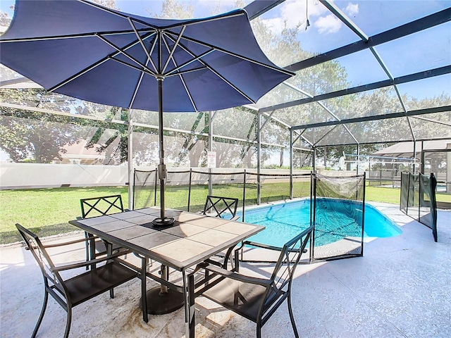 view of swimming pool featuring a patio, a yard, and a lanai