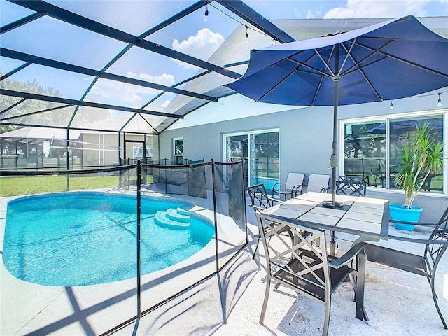 view of pool with a lanai and a patio