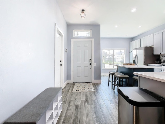 foyer with light hardwood / wood-style floors