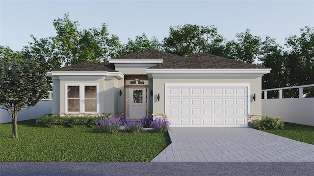 view of front of home featuring a front yard and a garage