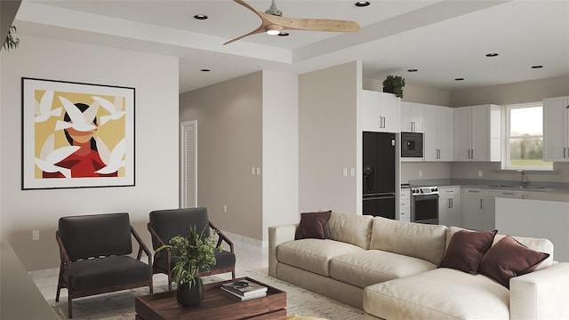 living room featuring sink and ceiling fan