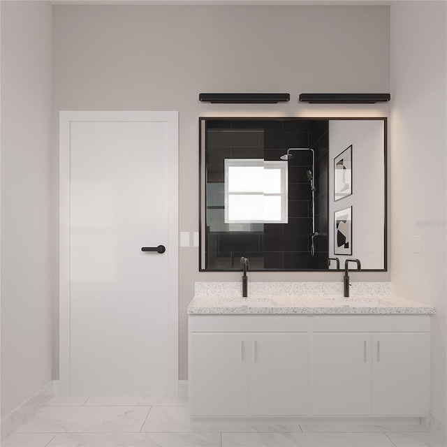 bathroom featuring vanity and a tile shower