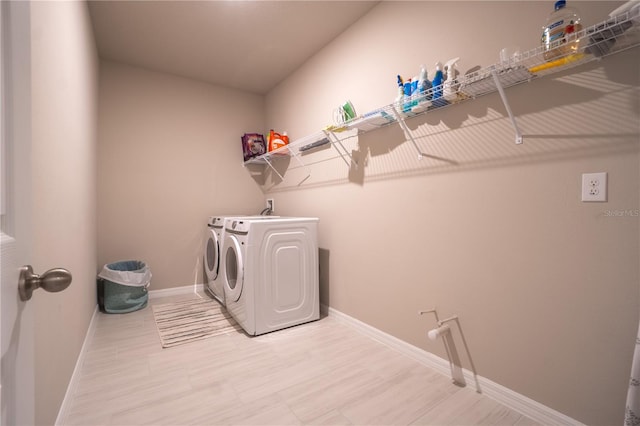 washroom with washer and clothes dryer