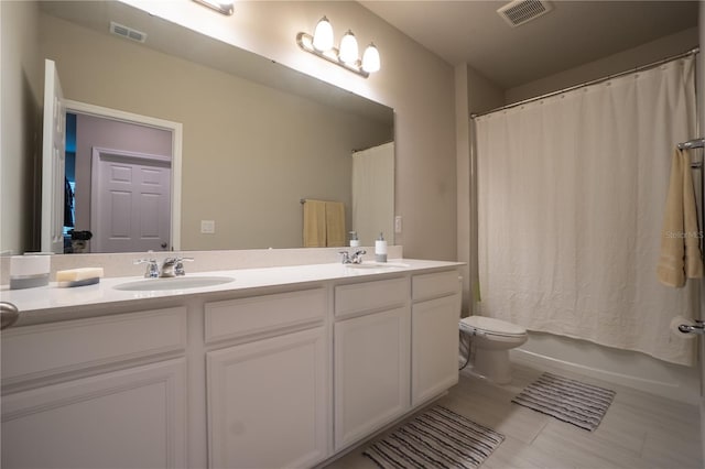 full bathroom with vanity, toilet, and shower / bath combo with shower curtain