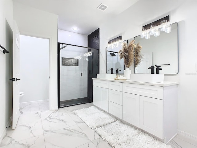 bathroom with vanity, walk in shower, and toilet