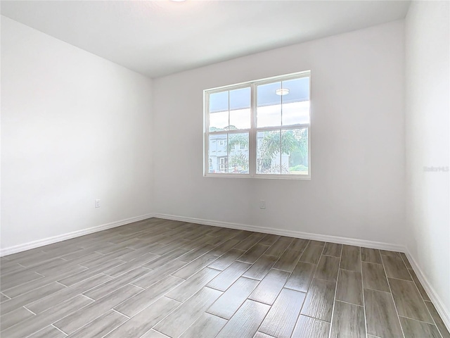 unfurnished room featuring wood-type flooring