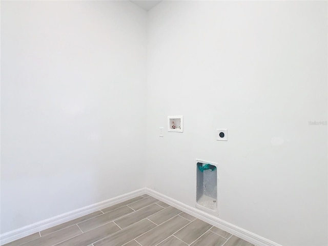 laundry area featuring light hardwood / wood-style floors, hookup for an electric dryer, and hookup for a washing machine