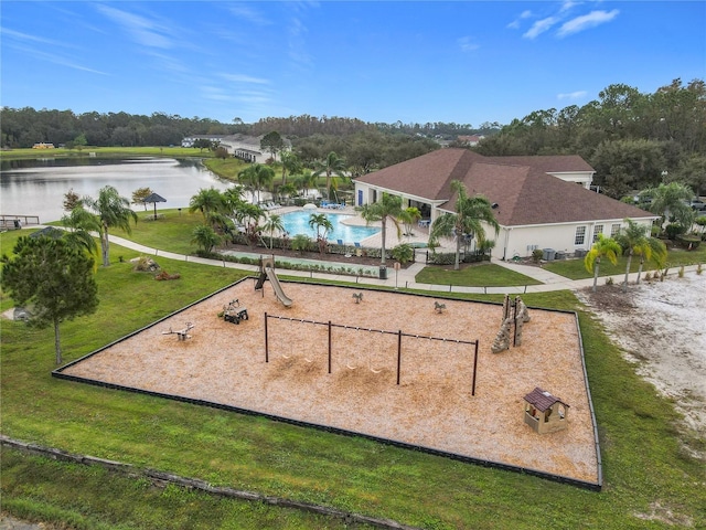 view of home's community featuring a water view, a lawn, and a swimming pool