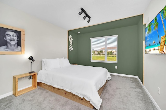 bedroom with light colored carpet