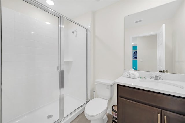 bathroom with walk in shower, vanity, and toilet