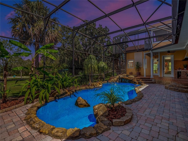 pool featuring a ceiling fan, a lanai, and a patio