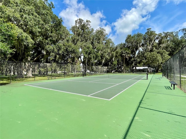 view of sport court with fence