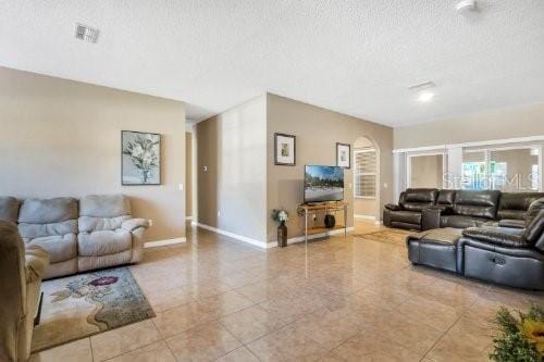 living room with a textured ceiling