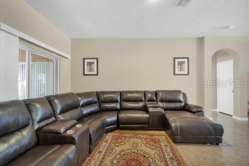 living room with a textured ceiling