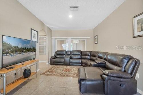 living room with light tile patterned flooring