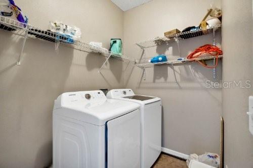 clothes washing area featuring washing machine and dryer