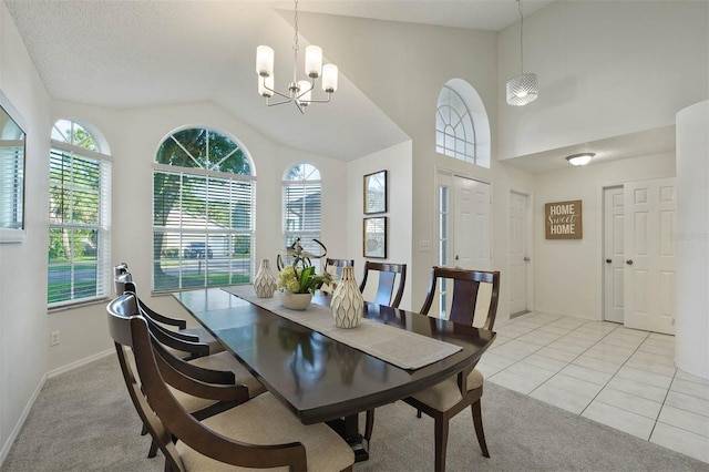 tiled dining area with a notable chandelier, a textured ceiling, and lofted ceiling