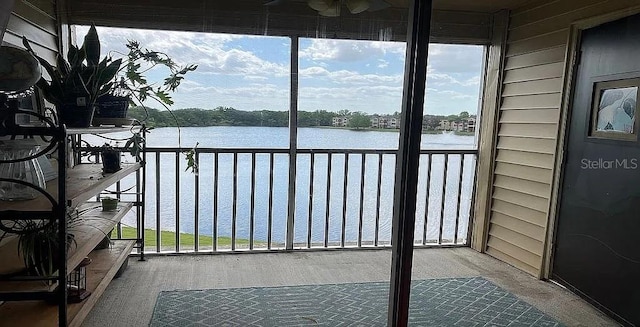 balcony featuring a water view