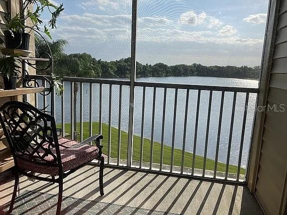 balcony featuring a water view