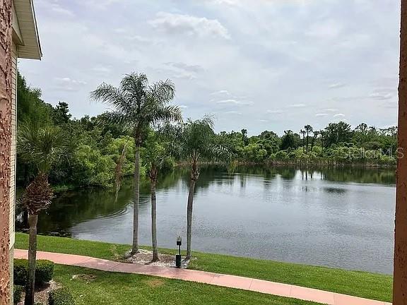 1909 Summer Club Dr Unit 307, Oviedo, FL 32765 - property view of water featuring a view of trees
