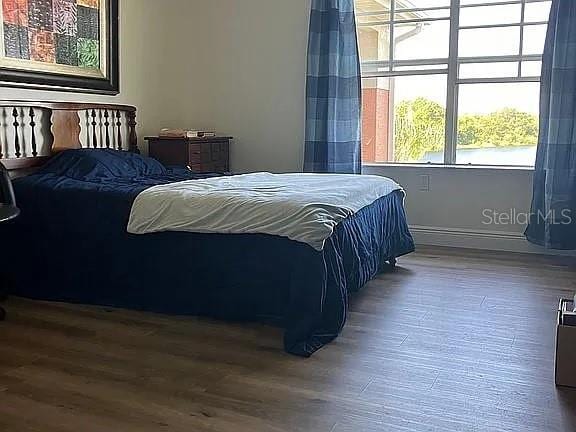 bedroom featuring wood-type flooring