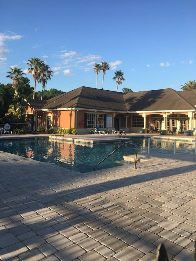 1909 Summer Club Dr Unit 307, Oviedo, FL 32765 - community pool featuring a patio area and fence