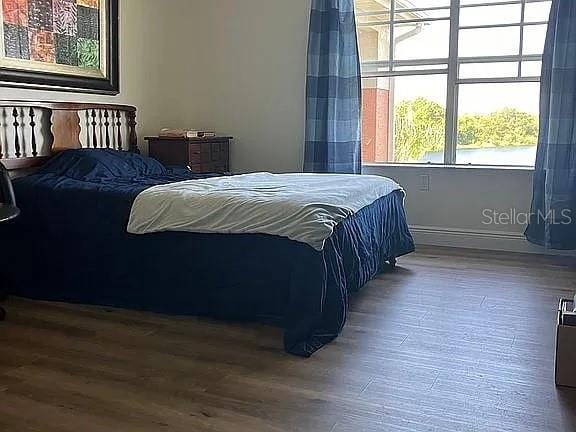1909 Summer Club Dr Unit 307, Oviedo, FL 32765 - bedroom with wood finished floors