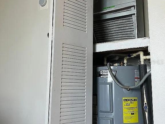 1909 Summer Club Dr Unit 307, Oviedo, FL 32765 - utility room with water heater