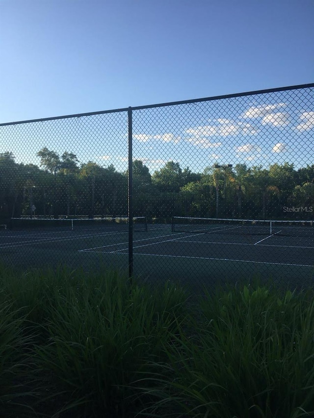 1909 Summer Club Dr Unit 307, Oviedo, FL 32765 - view of tennis court featuring fence