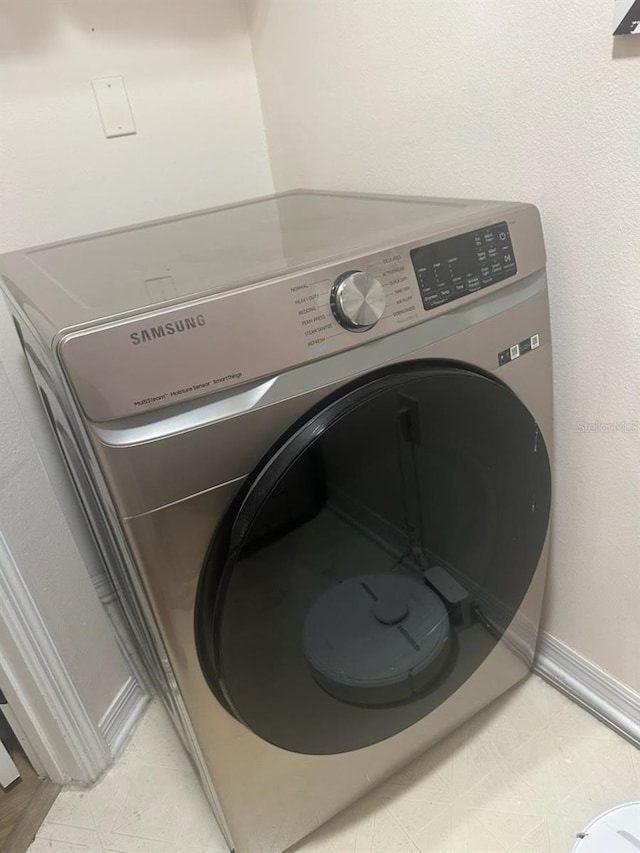 1909 Summer Club Dr Unit 307, Oviedo, FL 32765 - room details with washer / dryer and baseboards