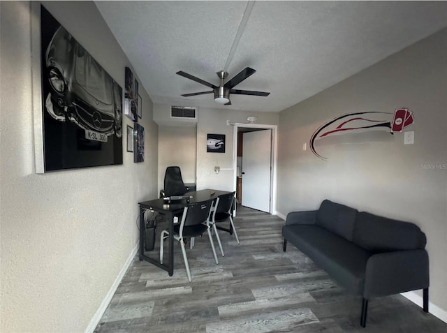 office space featuring a textured ceiling, hardwood / wood-style floors, and ceiling fan