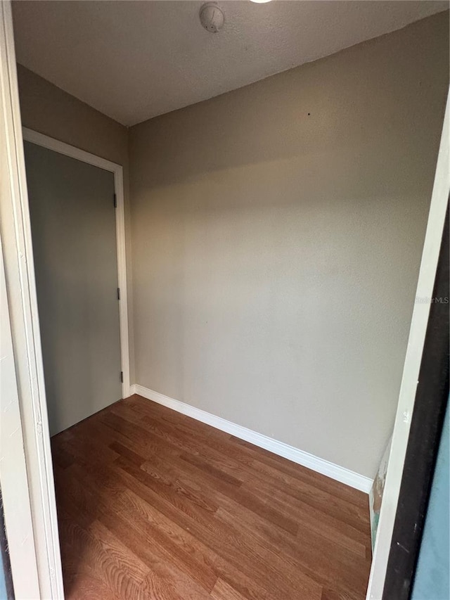 spare room featuring hardwood / wood-style flooring