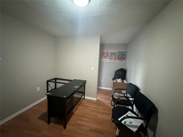 office area featuring a textured ceiling and hardwood / wood-style flooring